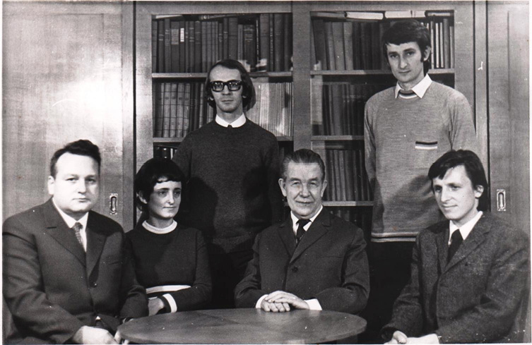 A 1972 group photo of Professor Ćwirko-Godycki with students and other anthropologists at the Department of Anthropology, Adam Mickiewicz University in Poznań. Sitting from left to right: Andrzej Malinowski, Maria Danuta Kaliszewska-Drozdowska, Michał Ćwirko-Godycki, and Jan Strzałko. Standing behind them: Joachim Cieślik and Janusz Piontek.