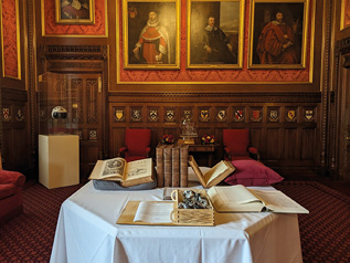 A table with books and papers on it.