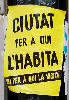 Anti-tourism protest sticker on a lamppost.  