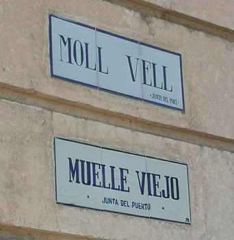 Two ceramic signs for Palma’s old port set into a wall, with the Catalan above the Spanish.  