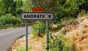 A road sign stating the distance to Andratx (8km), but with the sign stating the road was built by Republican prisoners removed. 