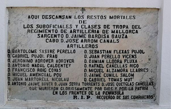 A stone plaque set into a wall indicating the names of those whose remains rest in that niche.  