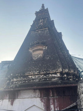 A new Muslim resident of the temple pictured here erroneously compared the Hindi word "om" carved on it to a Muslim greeting in an apparent effort to bridge the gap between the two peoples. "Om" is a religious chant in Hinduism and not a greeting.